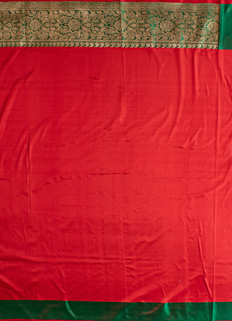 Beige color tussar silk saree with red and green border