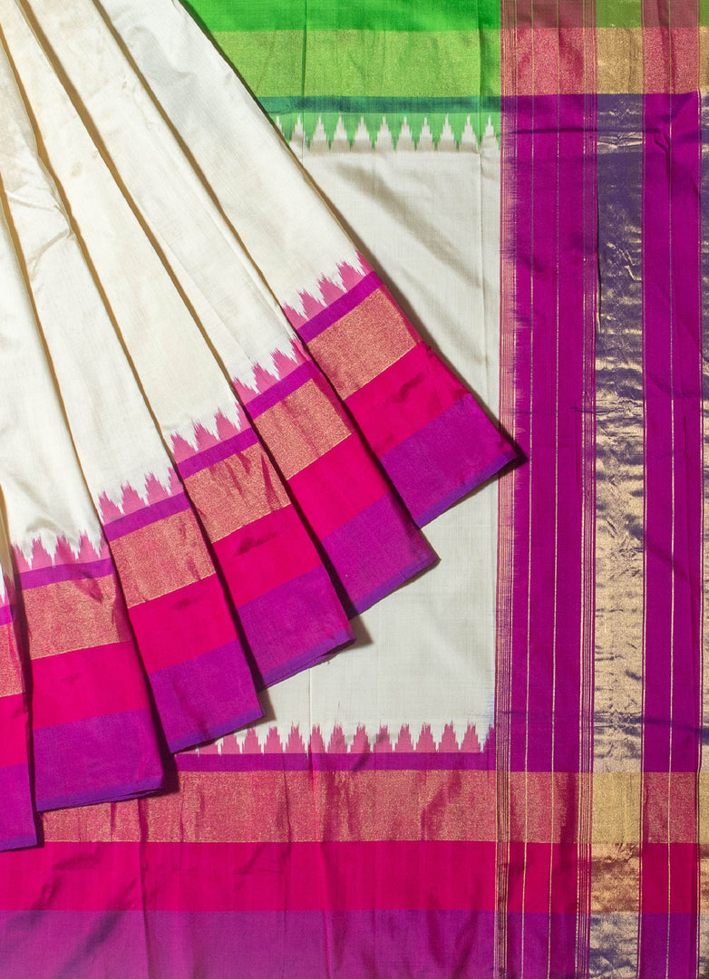 Ikat silk saree in white with multi color border.