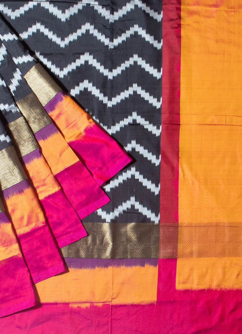 Ikat silk saree in black kesar and fusia pink