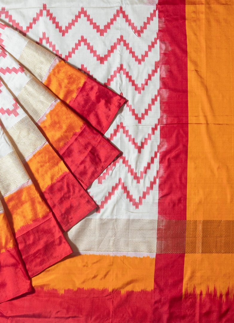 Ikat silk saree in White and orange combination